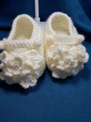 Blossom Baby Girl Booties, view 1 Cream crochet baby girl booties with blossom bobble detail