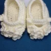 Blossom Baby Girl Booties, view 2 Cream crochet baby girl booties with blossom bobble detail