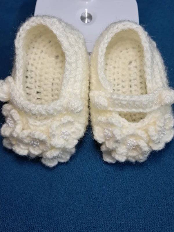 Blossom Baby Girl Booties, view 2 Cream crochet baby girl booties with blossom bobble detail