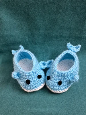 Light blue crochet whale baby booties