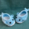 Blue Whale Baby Booties, view 2 Light blue crochet whale baby booties