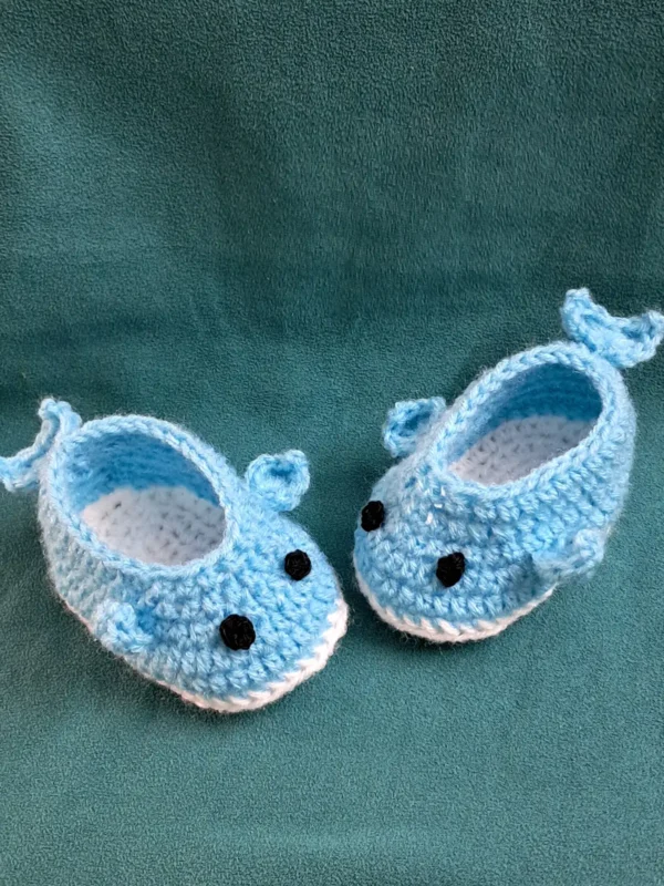 Blue Whale Baby Booties, view 2 Light blue crochet whale baby booties