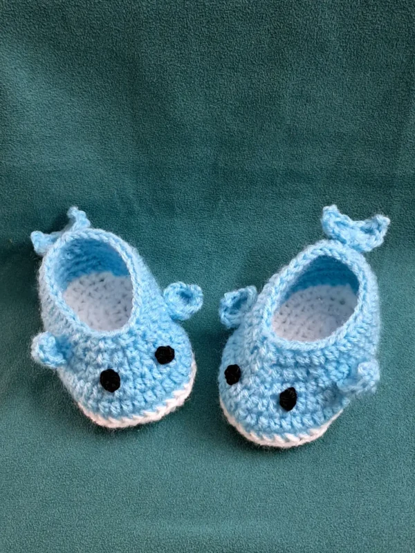Blue Whale Baby Booties, view 3 Light blue crochet whale baby booties