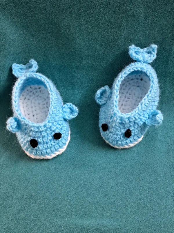 Blue Whale Baby Booties, view 4 Light blue crochet whale baby booties