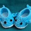 Blue Whale Baby Booties, view 5 Light blue crochet whale baby booties