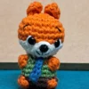 Little Fox Amigurumi, view 3 Crochet orange fox amigurumi in green shirt and blue tie