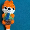 Little Fox Amigurumi, view 4 Crochet orange fox amigurumi in green shirt and blue tie