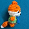 Little Fox Amigurumi, view 5 Crochet orange fox amigurumi in green shirt and blue tie