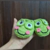 Little Frog Baby Booties, view 3 Green crochet frog baby booties with smiling face