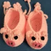 Pink Piggy Baby Booties, view 1 Peach pink crochet piggy baby booties with flower ties