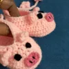 Pink Piggy Baby Booties, view 3 Peach pink crochet piggy baby booties with flower ties