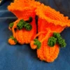 Pumpkin Baby Booties, view 1 Orange crochet pumpkin baby booties with green vine ties