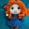 Red-Haired Princess Amigurumi Doll, view 1 Handmade crochet amigurumi doll with curly red hair and blue dress