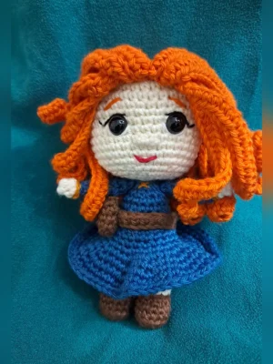Red-Haired Princess Amigurumi Doll, view 1 Handmade crochet amigurumi doll with curly red hair and blue dress