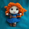 Red-Haired Princess Amigurumi Doll, view 2 Handmade crochet amigurumi doll with curly red hair and blue dress