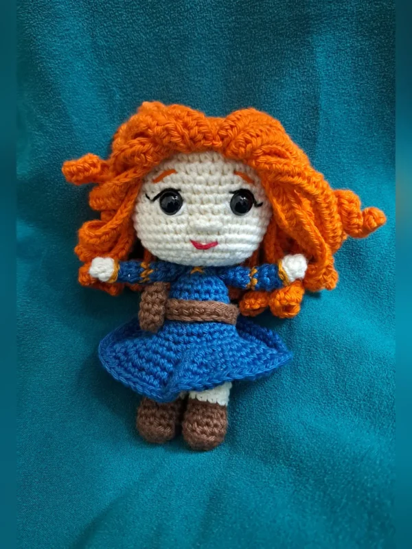 Red-Haired Princess Amigurumi Doll, view 2 Handmade crochet amigurumi doll with curly red hair and blue dress