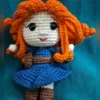 Red-Haired Princess Amigurumi Doll, view 3 Handmade crochet amigurumi doll with curly red hair and blue dress