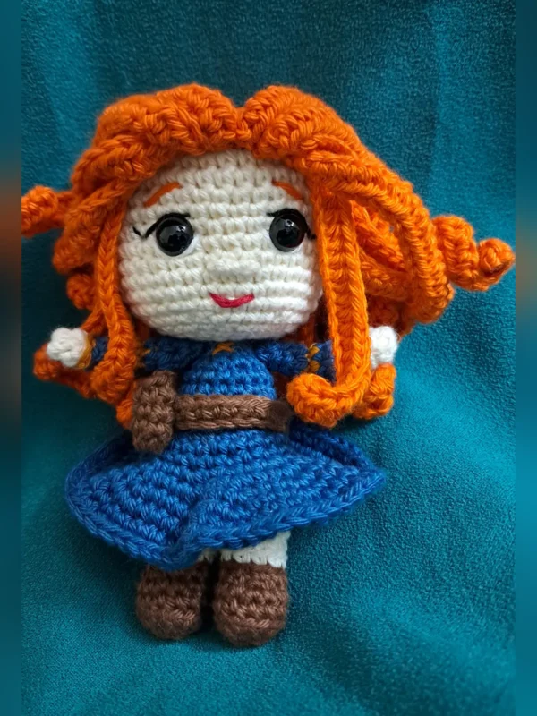 Red-Haired Princess Amigurumi Doll, view 3 Handmade crochet amigurumi doll with curly red hair and blue dress
